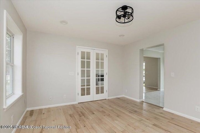 110 Island Rd, Toms River, NJ 08753 - unfurnished room featuring french doors, wood finished floors, healthy amount of natural light, and baseboards
