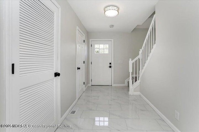 110 Island Rd, Toms River, NJ 08753 - entrance foyer with light marble finish floors, stairway, and baseboards