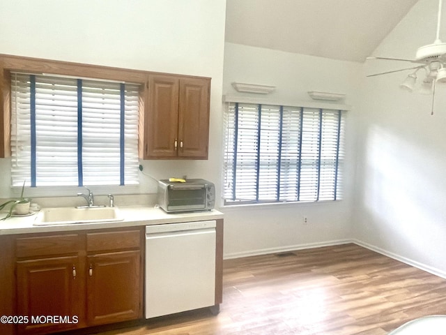 57 Pape Dr, Atlantic Highlands, NJ 07716 - kitchen featuring white dishwasher, a sink, a ceiling fan, plenty of natural light, and vaulted ceiling