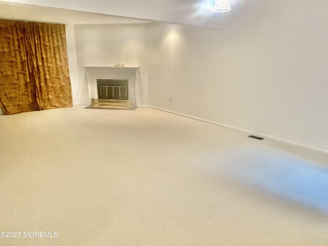 57 Pape Dr, Atlantic Highlands, NJ 07716 - unfurnished living room featuring carpet floors, a glass covered fireplace, and baseboards