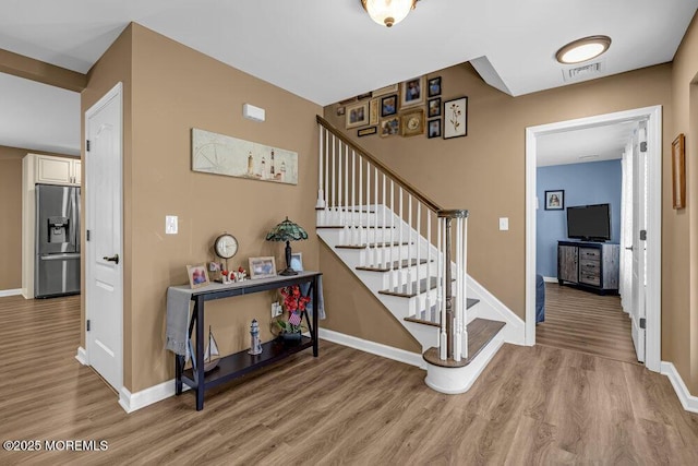 119 Darien Rd, Howell, NJ 07731 - stairway featuring wood finished floors and baseboards