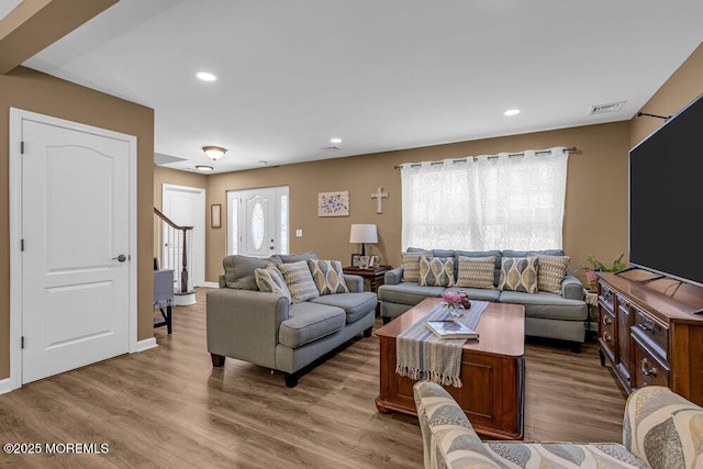 119 Darien Rd, Howell, NJ 07731 - living area with stairs, wood finished floors, and recessed lighting