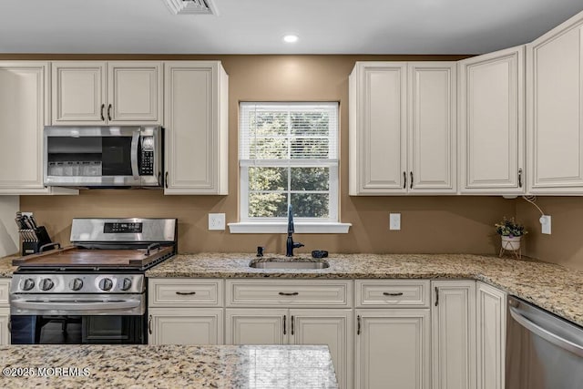 119 Darien Rd, Howell, NJ 07731 - kitchen with stainless steel appliances, a sink, white cabinetry, and recessed lighting