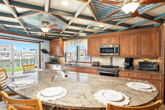 125 Bloomfield Rd, Barnegat, NJ 08005 - kitchen with ceiling fan, stainless steel appliances, a sink, brown cabinets, and coffered ceiling