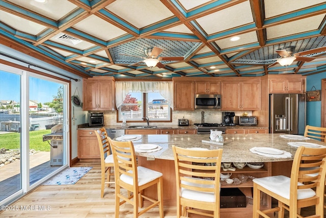 125 Bloomfield Rd, Barnegat, NJ 08005 - kitchen with appliances with stainless steel finishes, ceiling fan, a sink, light wood-type flooring, and decorative backsplash