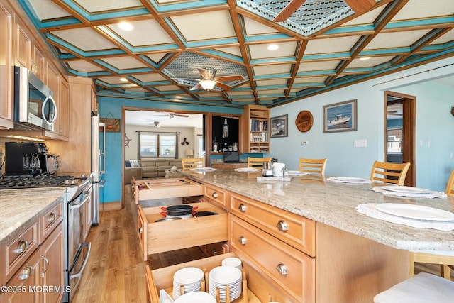 125 Bloomfield Rd, Barnegat, NJ 08005 - kitchen featuring stainless steel appliances, ceiling fan, coffered ceiling, light wood finished floors, and a kitchen breakfast bar