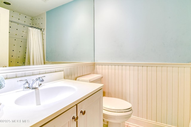 78 Cookman Ave, Ocean Grove, NJ 07756 - bathroom with toilet, vanity, wainscoting, and a shower with curtain