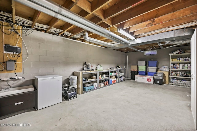 21 Windswept Ln, Freehold, NJ 07728 - unfinished below grade area featuring refrigerator and concrete block wall