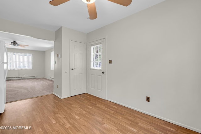 59 Maryland Ave Unit B, Whiting, NJ 08759 - foyer entrance featuring a ceiling fan, light wood-style floors, a baseboard heating unit, and baseboards