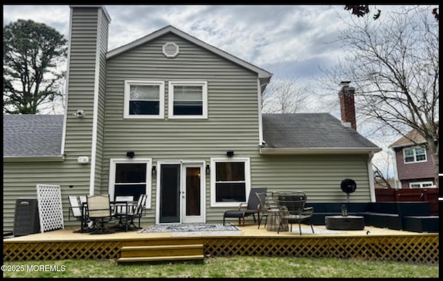 123 France St, Toms River, NJ 08753 - rear view of property with a chimney, a wooden deck, a shingled roof, and a yard