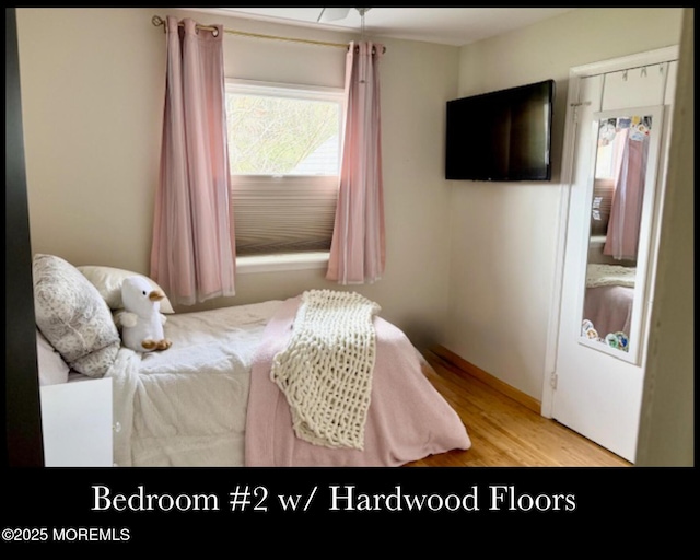123 France St, Toms River, NJ 08753 - bedroom featuring multiple windows, wood finished floors, and baseboards