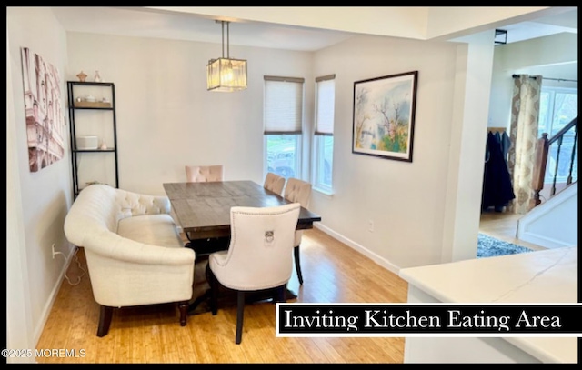 123 France St, Toms River, NJ 08753 - dining area featuring wood finished floors, baseboards, and a chandelier