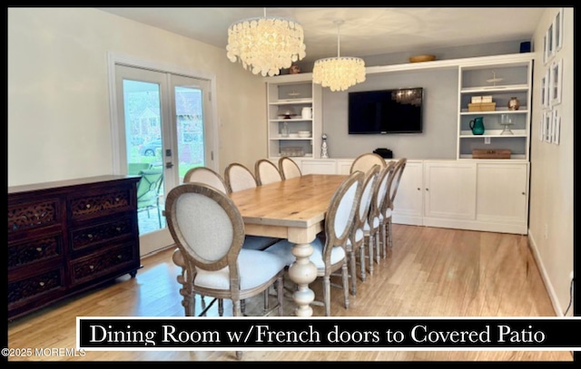 123 France St, Toms River, NJ 08753 - dining space featuring a chandelier, light wood-style floors, and healthy amount of natural light
