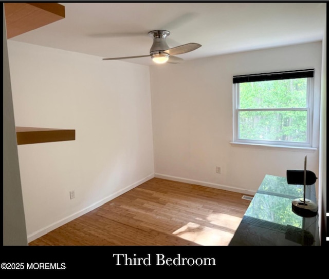 123 France St, Toms River, NJ 08753 - unfurnished room with wood finished floors, ceiling fan, and baseboards
