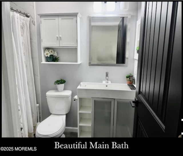 123 France St, Toms River, NJ 08753 - bathroom with toilet, vanity, and baseboards