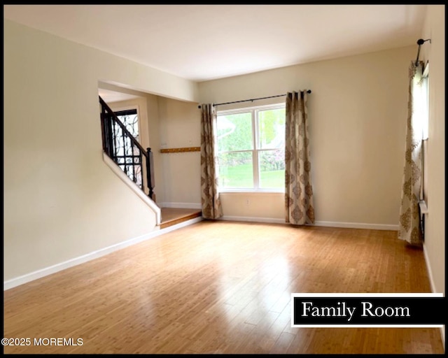 123 France St, Toms River, NJ 08753 - spare room featuring wood finished floors, stairway, and baseboards