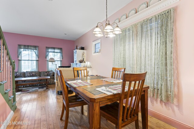 134 Franklin Ave, Ocean Grove, NJ 07756 - dining area with a chandelier, light wood-type flooring, and baseboards