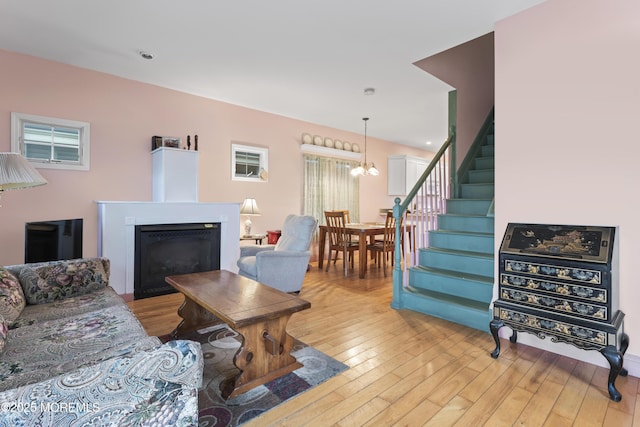 134 Franklin Ave, Ocean Grove, NJ 07756 - living room with stairway, light wood-style flooring, a fireplace, a chandelier, and recessed lighting