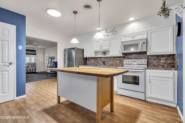4 Delaware Way Unit A, Whiting, NJ 08759 - kitchen with white appliances, butcher block counters, light wood-style flooring, tasteful backsplash, and white cabinetry