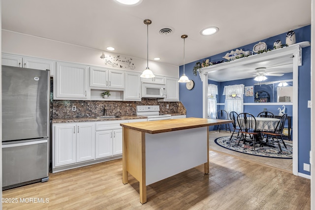 4 Delaware Way Unit A, Whiting, NJ 08759 - kitchen with white appliances, butcher block countertops, light wood-style floors, backsplash, and white cabinetry