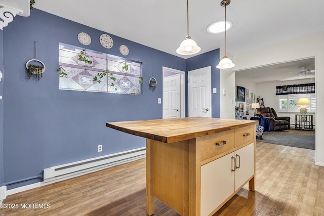 4 Delaware Way Unit A, Whiting, NJ 08759 - kitchen featuring a baseboard radiator, wood counters, wood finished floors, hanging light fixtures, and a kitchen island
