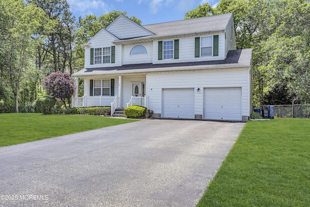 1 Overlook Ct, Manchester, NJ 08759 - traditional home featuring covered porch, an attached garage, and asphalt driveway