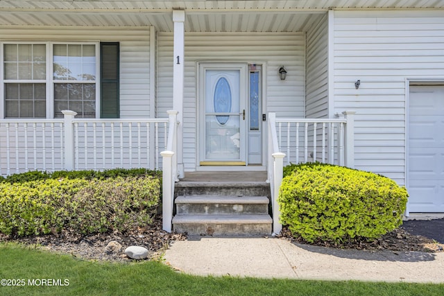 1 Overlook Ct, Manchester, NJ 08759 - view of exterior entry featuring a garage and a porch