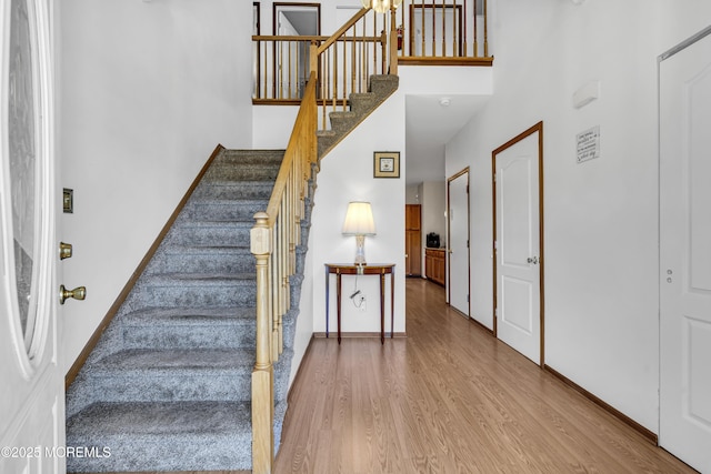 1 Overlook Ct, Manchester, NJ 08759 - stairway featuring a towering ceiling, wood finished floors, and baseboards
