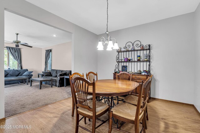 1 Overlook Ct, Manchester, NJ 08759 - dining room with light wood-style floors, a ceiling fan, a chandelier, and baseboards