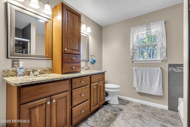 1 Overlook Ct, Manchester, NJ 08759 - full bathroom featuring double vanity, toilet, baseboards, and a bath