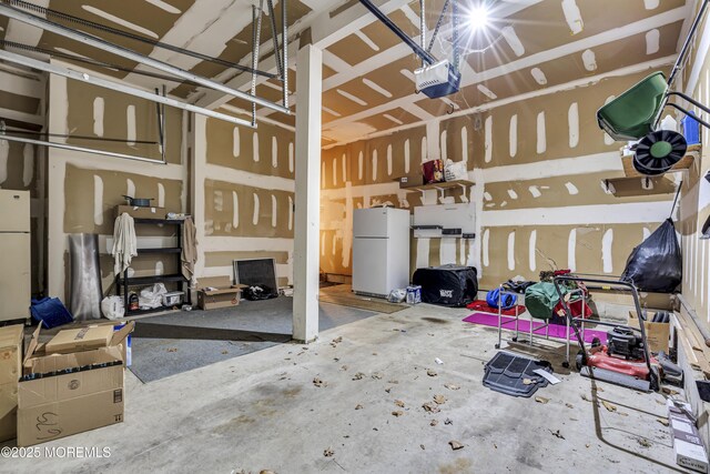 1 Overlook Ct, Manchester, NJ 08759 - garage featuring freestanding refrigerator and a garage door opener