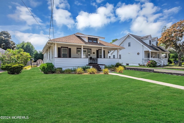 54 Wall St, West Long Branch, NJ 07764 - bungalow-style home with covered porch and a front yard