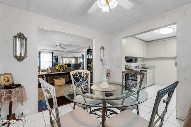 54 Wall St, West Long Branch, NJ 07764 - dining area featuring ceiling fan, light tile patterned floors, and a paneled ceiling