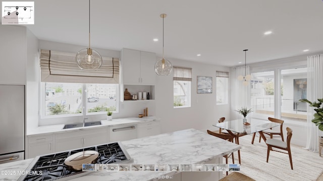 500 Ocean Ter Unit 9, Seaside Heights, NJ 08751 - kitchen with a sink, appliances with stainless steel finishes, white cabinetry, decorative light fixtures, and recessed lighting