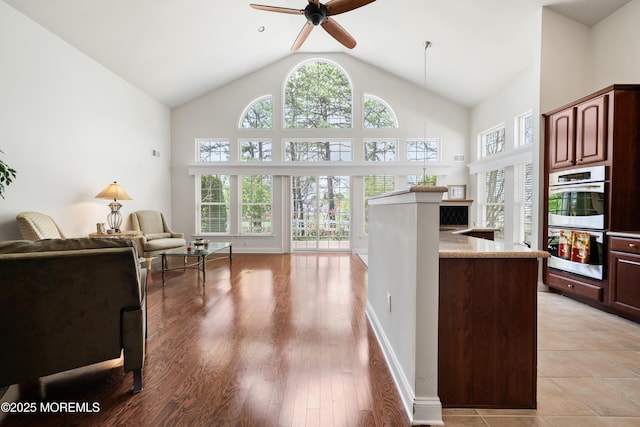 38 Point Pleasant Ln, Waretown, NJ 08758 - kitchen with healthy amount of natural light, stainless steel double oven, ceiling fan, open floor plan, and high vaulted ceiling