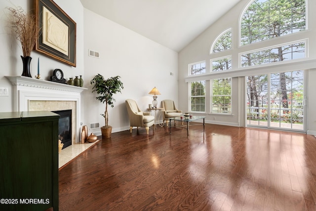 38 Point Pleasant Ln, Waretown, NJ 08758 - sitting room with high vaulted ceiling, wood finished floors, a high end fireplace, and baseboards