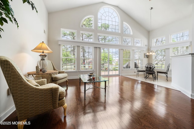 38 Point Pleasant Ln, Waretown, NJ 08758 - living area featuring wood finished floors, baseboards, and high vaulted ceiling