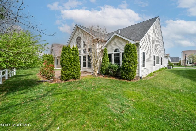 38 Point Pleasant Ln, Waretown, NJ 08758 - view of front of home with a front yard, cooling unit, and a shingled roof