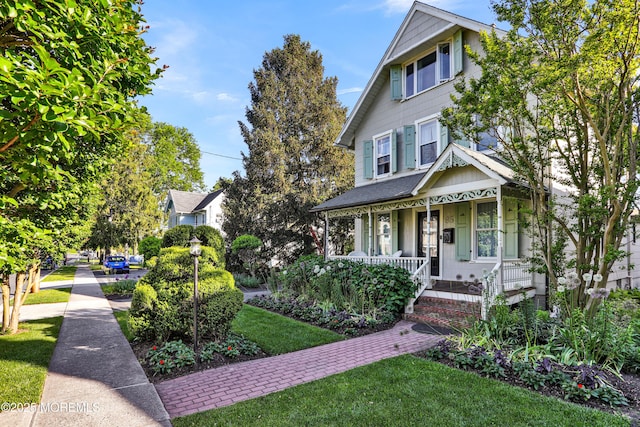 85 Virginia Ave, Manasquan, NJ 08736 - view of front facade featuring covered porch and a front yard