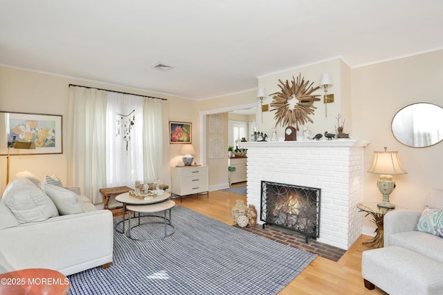 85 Virginia Ave, Manasquan, NJ 08736 - living area with a brick fireplace, wood finished floors, and crown molding