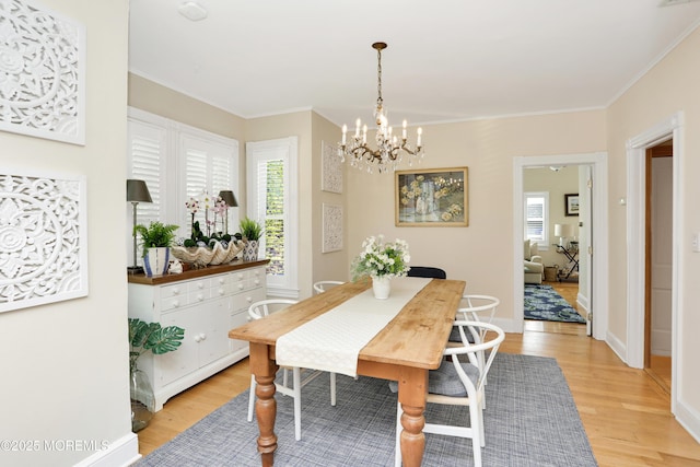 85 Virginia Ave, Manasquan, NJ 08736 - dining area featuring light wood finished floors, a chandelier, crown molding, and baseboards