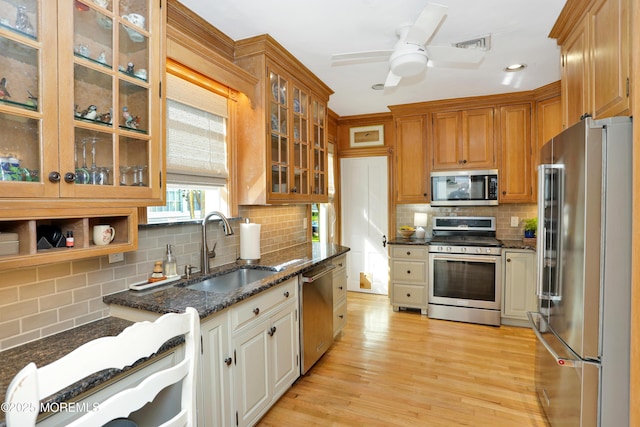 85 Virginia Ave, Manasquan, NJ 08736 - kitchen featuring stainless steel appliances, a sink, tasteful backsplash, dark stone counters, and a ceiling fan