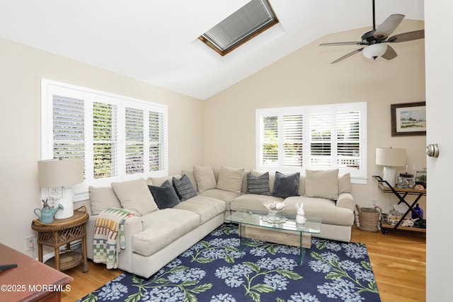 85 Virginia Ave, Manasquan, NJ 08736 - living area featuring wood finished floors, vaulted ceiling, ceiling fan, and a skylight