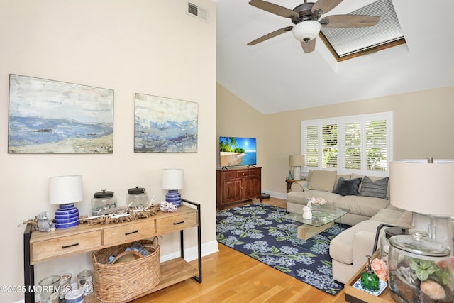 85 Virginia Ave, Manasquan, NJ 08736 - living area with a ceiling fan, wood finished floors, baseboards, a skylight, and high vaulted ceiling