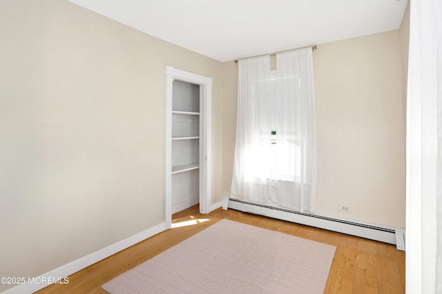 85 Virginia Ave, Manasquan, NJ 08736 - unfurnished room featuring baseboard heating, wood finished floors, and baseboards