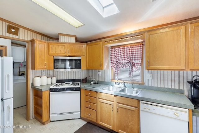 1400 Forest Way, Whiting, NJ 08759 - kitchen with white appliances, a sink, washer / clothes dryer, a skylight, and wallpapered walls