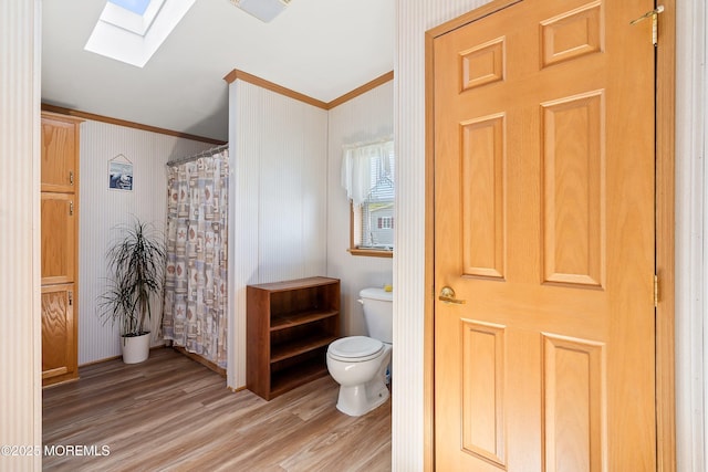 1400 Forest Way, Whiting, NJ 08759 - full bath featuring a skylight, toilet, ornamental molding, wood finished floors, and a shower with curtain