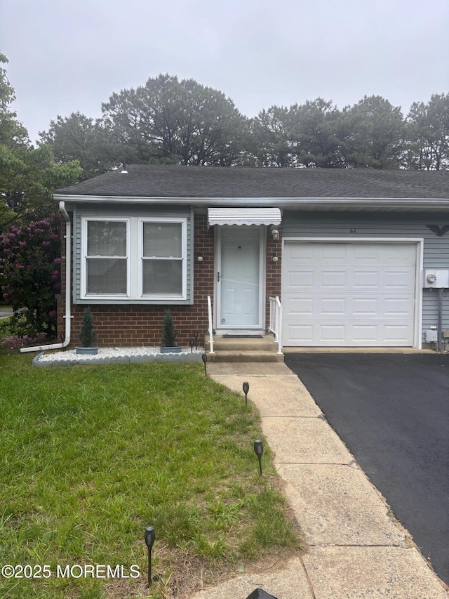 6 Ardmore St Unit A, Whiting, NJ 08759 - single story home with brick siding, a garage, driveway, and a front lawn