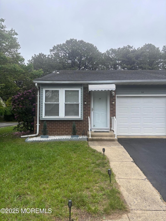6 Ardmore St Unit A, Whiting, NJ 08759 - ranch-style house featuring brick siding, a front lawn, an attached garage, and asphalt driveway