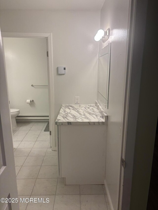 6 Ardmore St Unit A, Whiting, NJ 08759 - bathroom with a baseboard heating unit, marble finish floors, and toilet